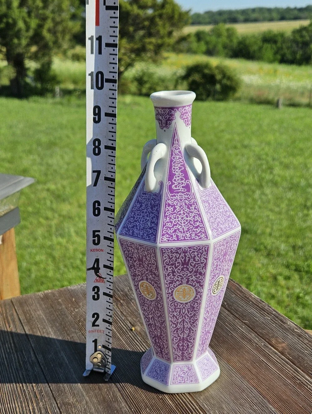 Chinese porcelain vase with purple and white floral and geometric patterns with